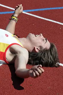 Exhausted Prints: Ben Brand Isle of Man exhausted runner in the Men's 400m Heat at Natwest Island Games 2009