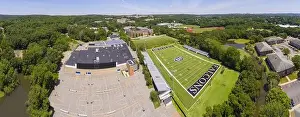 College Education Prints: Bentley University Dana Athletic Center and Bentley Falcons football court aerial view in city of Waltham