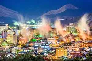 Beppu, Japan cityscape with hot spring bath houses at night