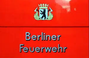 Volunteers Prints: Berlin, the fire department logo on a police car