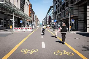 Pop Up Prints: Berlin, Germany - April, 2022: People on Bicycle lane or pop-up bike lane in Berlin (Friedrichstrasse)