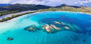 Dreamlike Prints: Best beaches of Corsica island - aerial view of beautiful Santa Giulia long beach with sault lake from one side