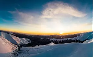 Hill Glacier Prints: Bewitching view of the winter ski slopes on a winter sunny evening with shining sun and blue sky