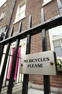Attached Prints: No Bicycles Please sign attached to metal railings Dublin Republic of Ireland