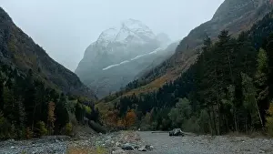 Mountain Top Prints: Big high mountains. Creative. Huge hills covered with snow and overgrown with green fir trees and pine trees around
