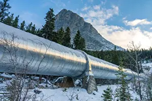 Power Plant Prints: Big pipeline in Grassi Lakes hiking trail connects Whitemans Pond and Rundle Forebay