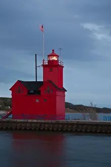 State Park Prints: Big Red lighthouse on a Lake Michigan MI Holland harbor Ottawa county Great Lakes low angle a flag on flagpole vertical