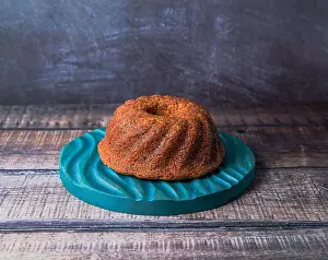 Parents Prints: A big round cupcake on dark wooden background