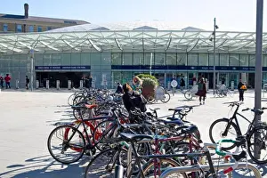 Cyclists Prints: Bikes bicycles parked outside Kings Cross Railway Station in bike stand people commuters cyclists parking cycle London