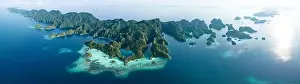 Misool Prints: Biodiverse coral reefs surround the dramatic limestone islands that have been uplifted from Raja Ampat's beautiful