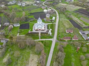 Up High Prints: A bird view of charming Christian church nestled in the heart of the village