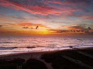A bird's eye view of a beach during a sunset