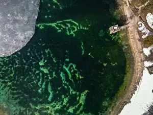 Julian Prints: bird's-eye view of Jezero Jasna. Icy man-made lake in Slovenia. Snowy lakeside