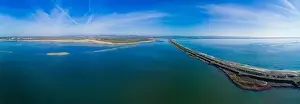 A bird's eye view panorama of a wild sandy dry grass shore washed by a deep calm evening Black sky in Bulgaria