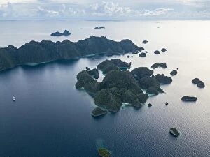 Images Dated 12th November 2017: A bird's eye view shows dramatic limestone islands rising from the peaceful