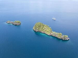 Images Dated 12th November 2017: A bird's eye view shows dramatic limestone islands rising from the peaceful
