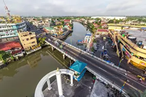 Riverfront Prints: Bird's eye view of Tabuco Bridge spanning Naga River with part of Naga City