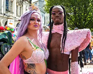 Sequins Prints: Birmingham Pride 2019. Revellers wearing wonderful costumes and makeup wait for the parade to begin