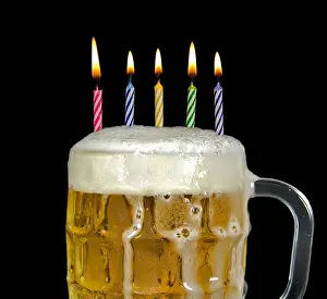 Foamy Prints: Birthday candles in a mug of beer with foam