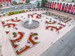 Bishkek, Kyrgyzstan - July 15, 2023: Aerial view of Bishkek city's Ala-Too central square with waving flag
