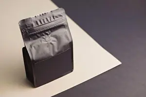 Pouch Prints: Black blank plastic vacuum sealed pouch coffee bag mockup. Packaging template mockup