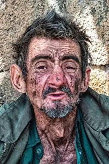 Homelessness Prints: Black homeless man with a dirty appearance and a thoughtful look - poverty and social issues concept