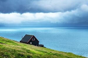 Images Dated 30th July 2019: Black house on famous faroese Witches Finger Trail