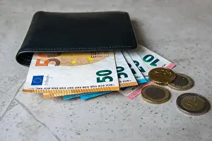 Debit Prints: Black partmone with european money. Coins and bills in leather wallet for commerce concept