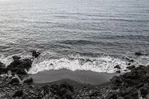 Black Sand Beach Prints: Black sand beach aerial view. Grey and black volcanic rocks and ocean waves
