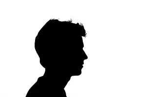 Shadowed Prints: Black silhouette of an unknown person on a white background