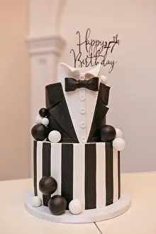 Cupcake Prints: Black and white cake on the table with the inscription happy 47th birthday