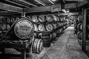 Patience Prints: Black and white image of whisky maturing in barrels at the renowned Laphroaig Distillery