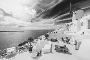 Black and white image of white architecture in Santorini Oia, Greece. Monochrome travel landscape. Dramatic process, Aegean sea in black and white