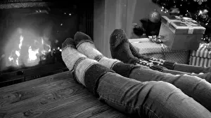 Fireplace Prints: Black and white photo of family relaxing by the fireplace on Christmas eve