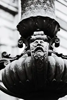 Bench Prints: A black and white photograph of a statue sitting on a bench