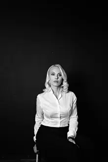 Beautiful Woman Prints: Black and white studio portrait of an attractive blond business woman in a white shirt