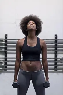 Curls Prints: black woman doing bicep curls