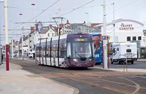 Tramway Prints: Blackpool Flexity tram passing a bus on the promenade, Blackpool