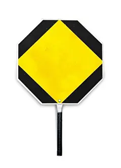 Prevent Prints: Blank yellow stop sign used for traffic control by crossing guards