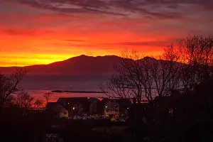 Fiery Prints: Blazing volcano like sunset over the hills of Goatfell