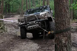 Off Road Prints: Blue 4x4 Land Rover Defender 90 winching during a muddy off-road challenge
