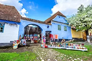Stronghold Prints: Blue painted traditional house with green windows from village in Transylvania