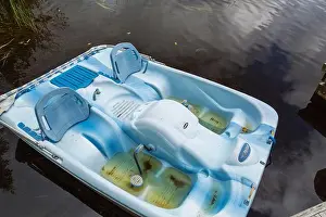 Contamination Prints: Blue Pelican pedal boat filled with rainwater in summer, Quebec, Canada