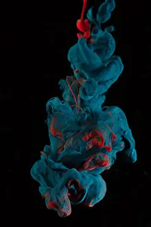 Abyss Prints: Blue and Red ink falling into water and mixing as it falls