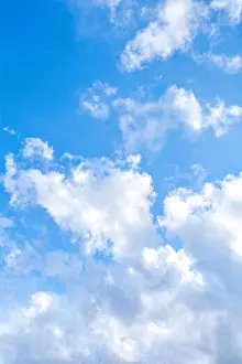 Blue Day Prints: Blue sky background and fluffy white large cloud in sunny day