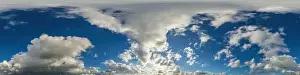 Blue sky panorama with puffy Cumulus clouds