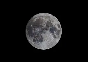 Gray Prints: A full Blue Sturgeon Supermoon glowing in the night sky over Canada against a black background August 19