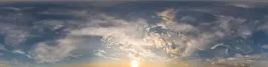 Blue sunset sky panorama with puffy Cumulus clouds