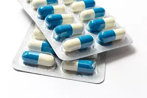 Medicament Prints: Blue and white capsules close up