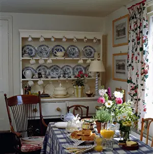 Crockery Prints: Blue & white china on white dresser in country dining room with floral drapes